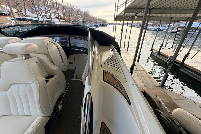  Yacht Photos Pics 2004 Cobalt 343 boat docked, featuring luxurious white seating and sleek design.