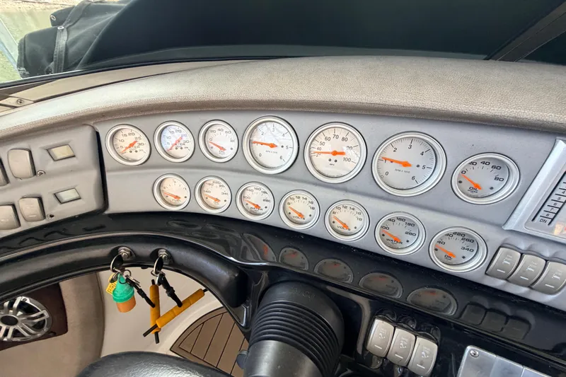  Yacht Photos Pics Dashboard of a 2004 Cobalt 343 boat with multiple gauges and controls.