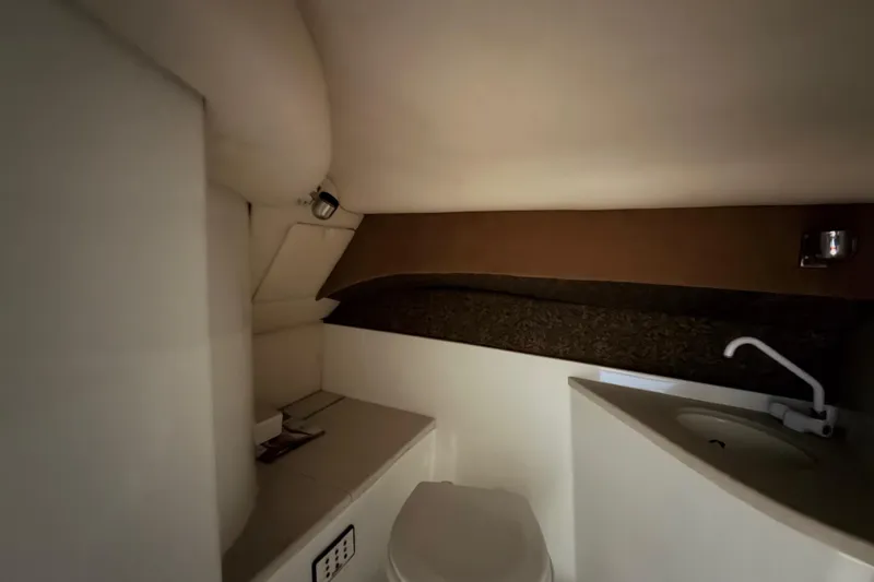  Yacht Photos Pics 2004 Cobalt 343 boat interior bathroom with sink and toilet.