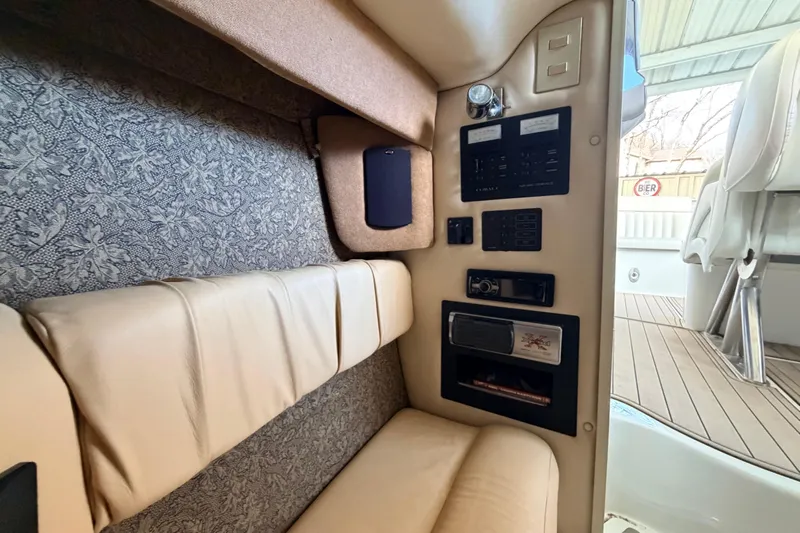  Yacht Photos Pics Interior of a 2004 Cobalt 343 boat with control panel and seating area.