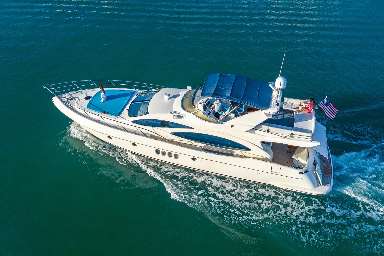 Azimut Fly 68 yacht cruising on open water, 2003 model, aerial view.