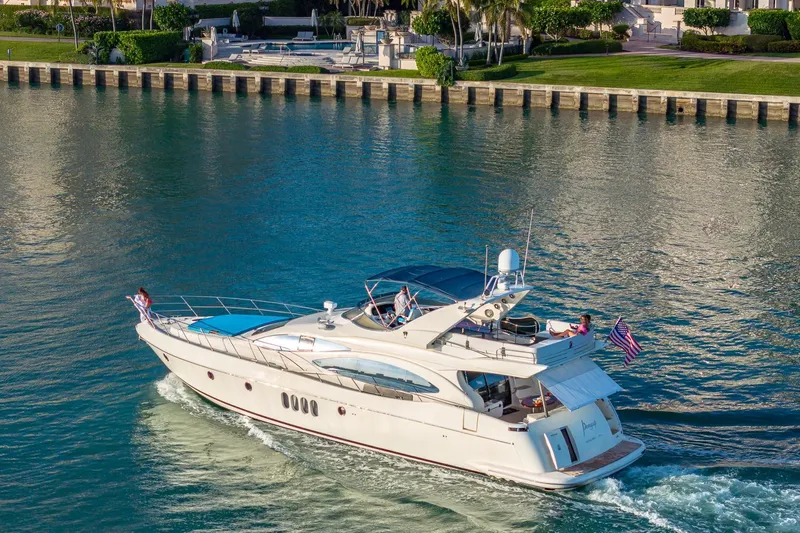 "pony Up" Yacht Photos Pics Luxury Azimut Fly 68 yacht cruising on serene waters, 2003 model.