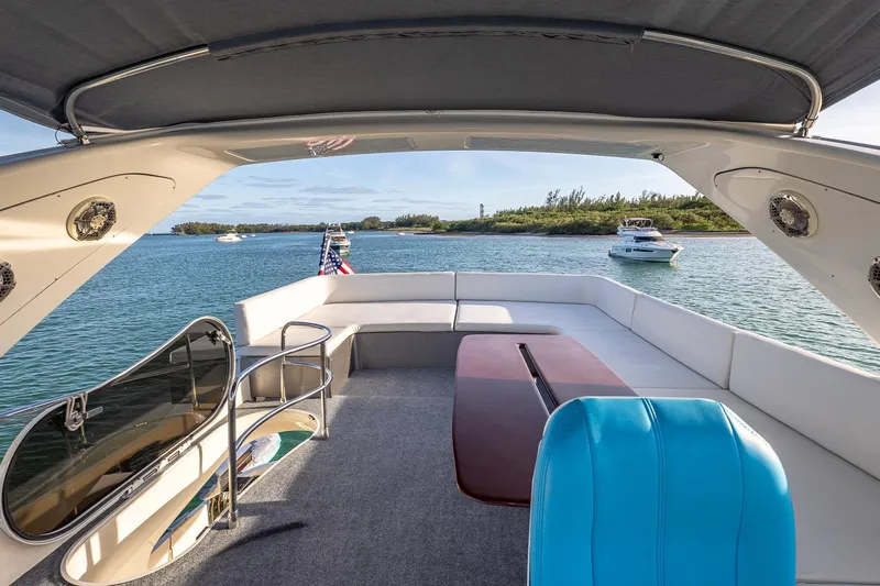 "pony Up" Yacht Photos Pics Azimut Fly 68 yacht interior, 2003 model, with scenic water view and seating area.