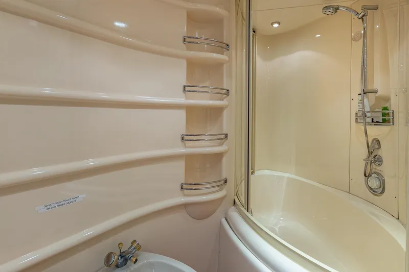 "pony Up" Yacht Photos Pics Luxurious bathroom in 2003 Azimut Fly 68 yacht with modern shower and sleek design.