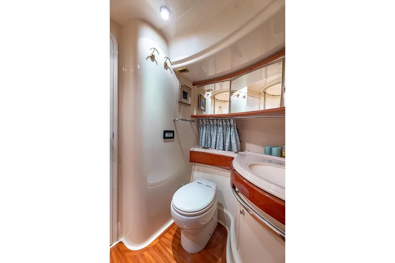 "pony Up" Yacht Photos Pics Luxurious bathroom interior of 2003 Azimut Fly 68 yacht with elegant fixtures.