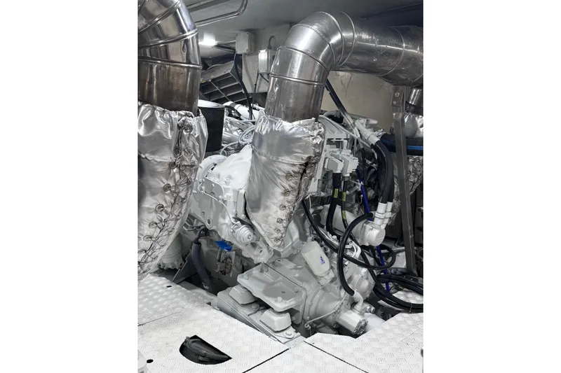 "pony Up" Yacht Photos Pics Engine room of 2003 Azimut Fly 68 yacht with insulated pipes and machinery.