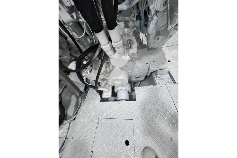 "pony Up" Yacht Photos Pics Engine room of 2003 Azimut Fly 68 yacht, showcasing mechanical components and piping.