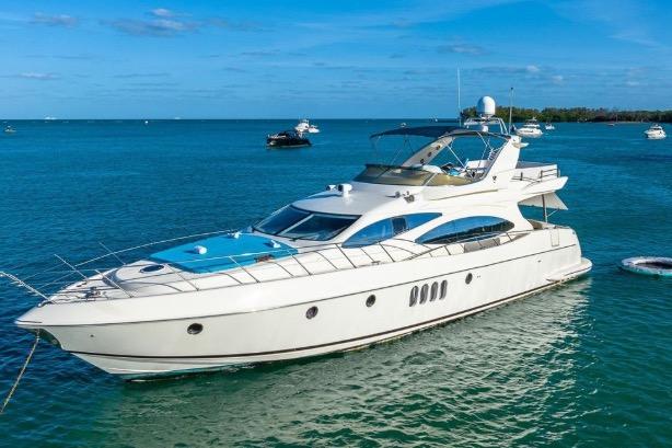Luxury 2003 Azimut Fly 68 yacht on serene blue waters.