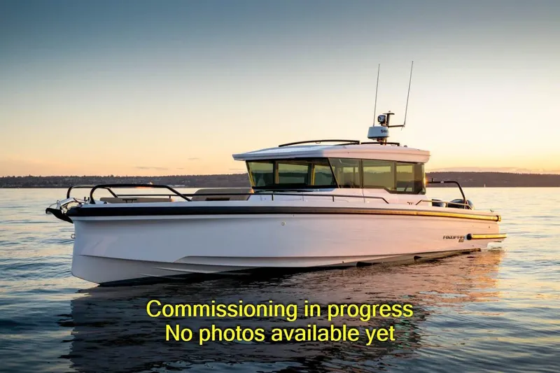  Yacht Photos Pics 2024 Axopar 37XC CROSS CABIN boat on water at sunset.