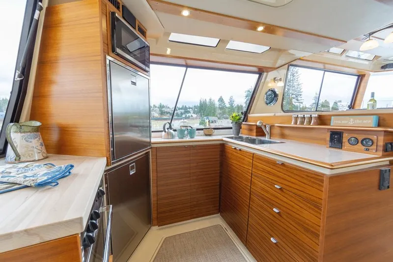  Yacht Photos Pics Luxurious kitchen interior of 2025 Ranger Tugs 43 Command Bridge yacht.