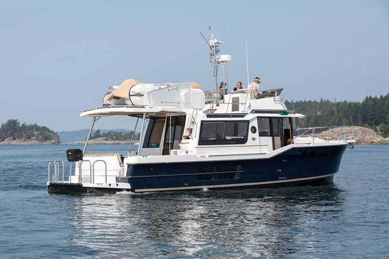  Yacht Photos Pics 2025 Ranger Tugs 43 Command Bridge yacht cruising on calm waters.