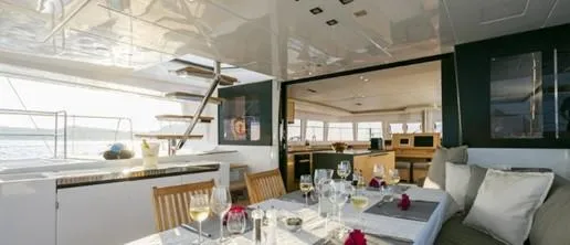  Yacht Photos Pics Luxurious Lagoon 620 yacht interior with elegant dining setup, 2015 model.