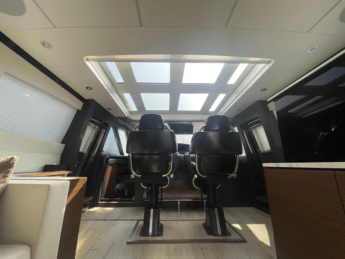 Blade Yacht Photos Pics Luxurious interior of a 2007 Pantera 80 GT yacht with modern seating and skylight.