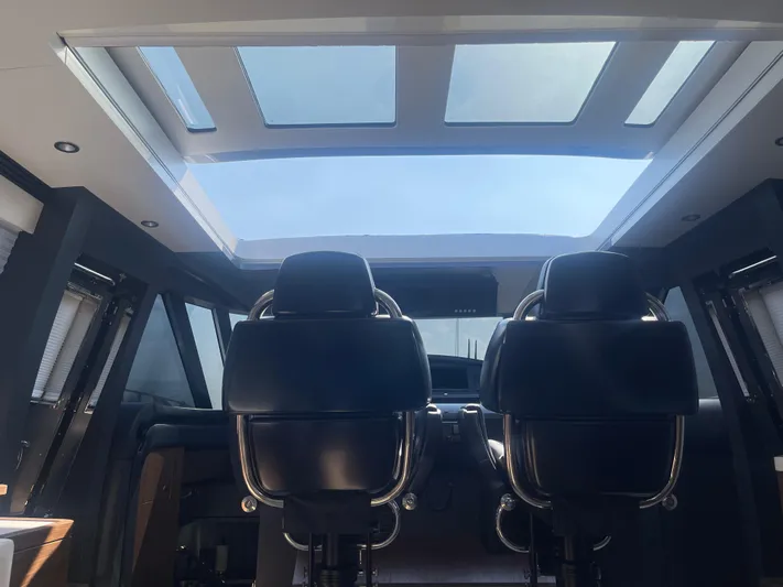 Blade Yacht Photos Pics Interior view of a 2007 Pantera 80 GT yacht with skylight and leather seats.