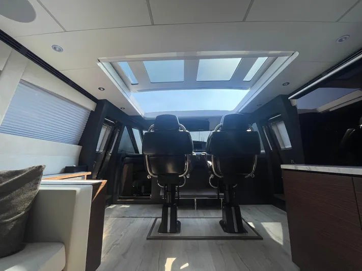 Blade Yacht Photos Pics Luxurious interior of a 2007 Pantera 80 GT yacht with skylight and modern seating.