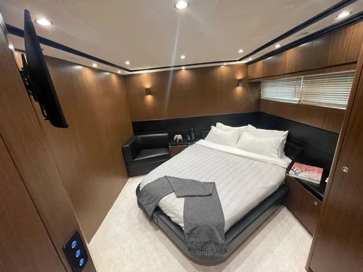 Blade Yacht Photos Pics Luxurious bedroom interior of 2007 Pantera 80 GT yacht with modern decor and cozy lighting.