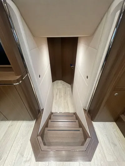 Blade Yacht Photos Pics Staircase inside 2007 Pantera 80 GT yacht, featuring sleek wood and modern design.