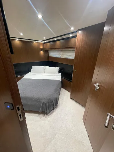 Blade Yacht Photos Pics Luxurious bedroom interior in 2007 Pantera 80 GT yacht, featuring modern wood paneling.