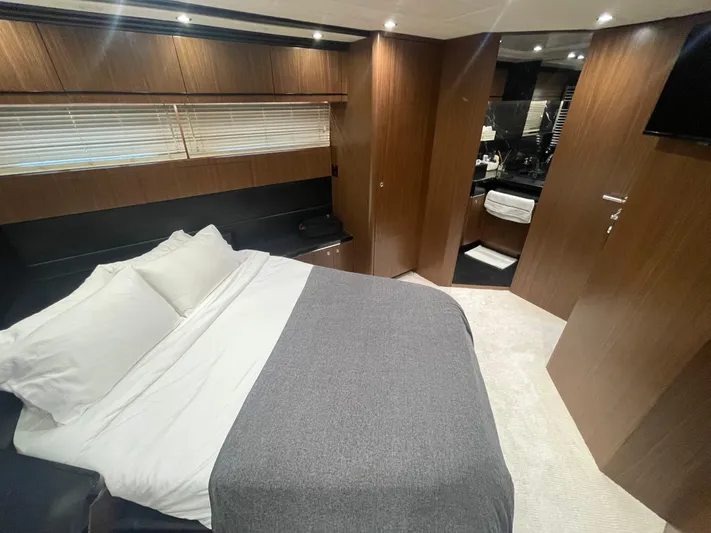 Blade Yacht Photos Pics Luxurious bedroom interior in a 2007 Pantera 80 GT yacht, featuring modern wood paneling.