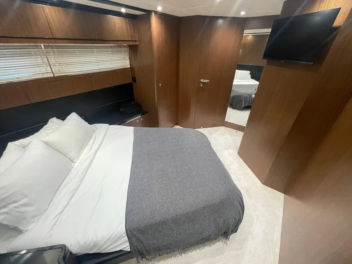 Blade Yacht Photos Pics Luxurious bedroom interior in 2007 Pantera 80 GT yacht with modern wood paneling.