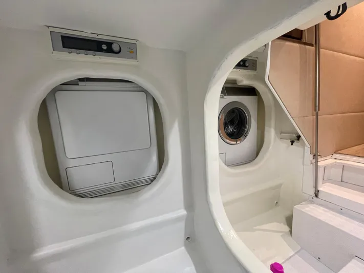 Blade Yacht Photos Pics Laundry area inside a 2007 Pantera 80 GT yacht, featuring washer and dryer units.