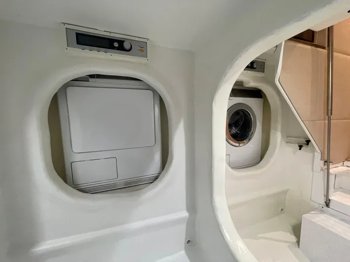 Blade Yacht Photos Pics Laundry area inside a 2007 Pantera 80 GT yacht, featuring modern washing machines.