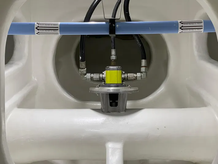 Blade Yacht Photos Pics Close-up of a 2007 Pantera 80 GT's black water treatment system with pipes and fittings.