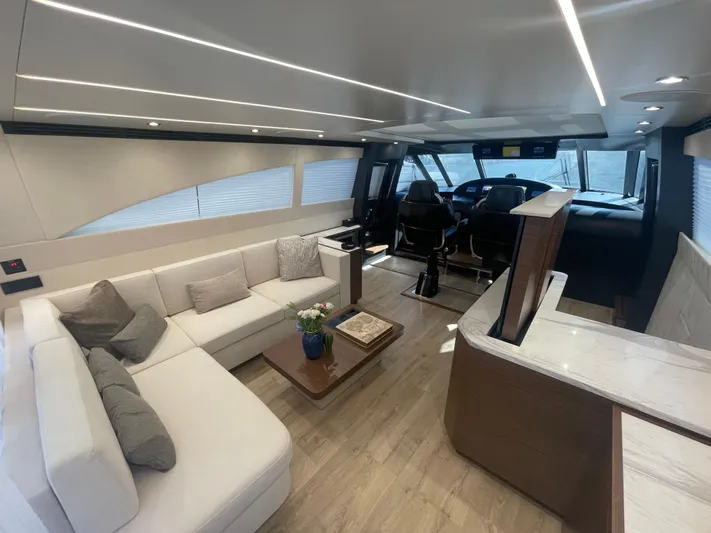 Blade Yacht Photos Pics Luxurious yacht interior with modern seating, wooden flooring, and helm station, Pantera 80 GT 2007.