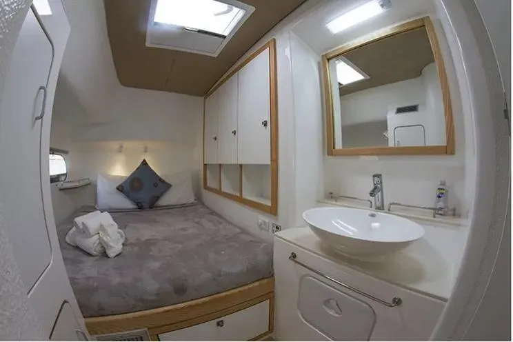 Electrify Yacht Photos Pics Luxurious cabin interior of 2018 Voyage Yachts 480E with bed and sink.