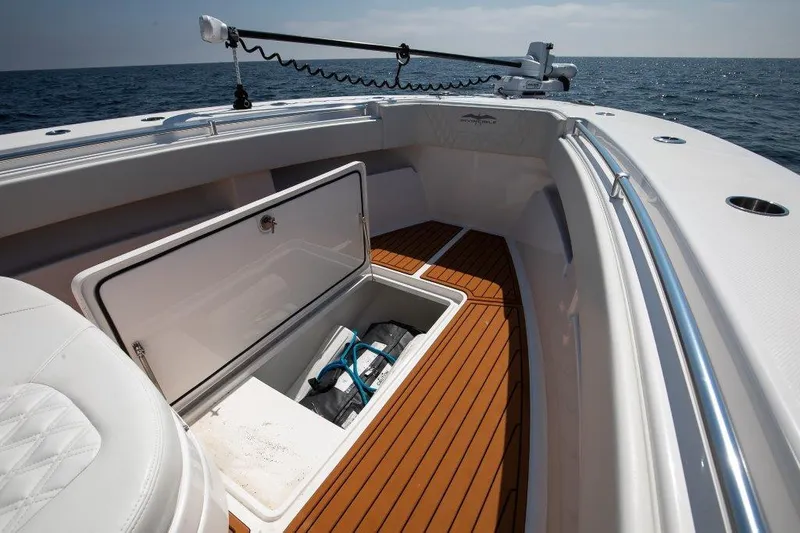  Yacht Photos Pics 2023 Invincible 36 Open boat with open storage compartment on deck.