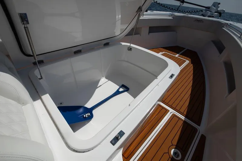  Yacht Photos Pics Open storage compartment on 2023 Invincible 36 Open boat with wooden deck.