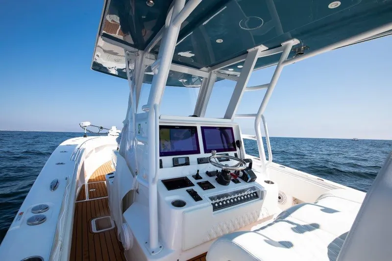  Yacht Photos Pics 2023 Invincible 36 Open boat interior with modern helm and ocean view.