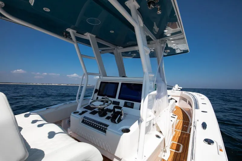  Yacht Photos Pics 2023 Invincible 36 Open boat, sleek design, ocean view, advanced navigation system.