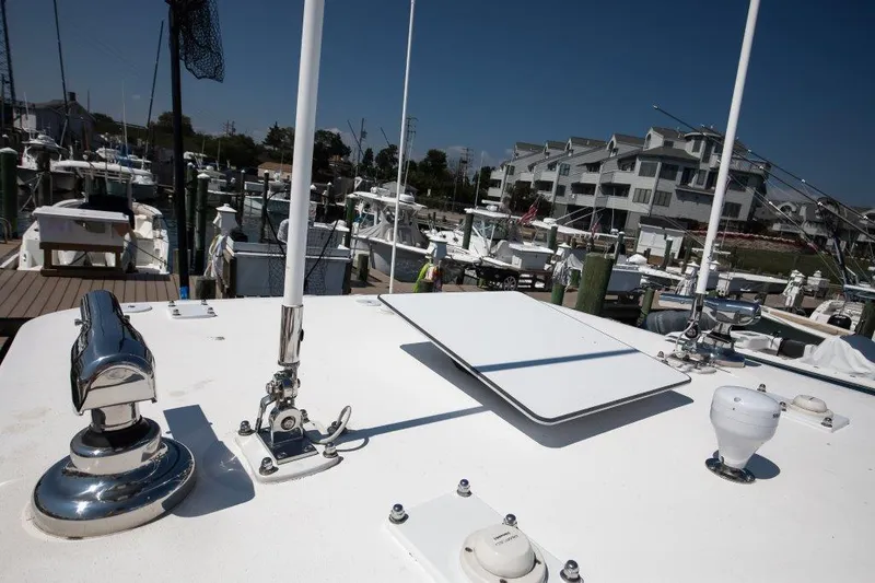  Yacht Photos Pics 2023 Invincible 36 Open boat docked at marina with modern equipment.