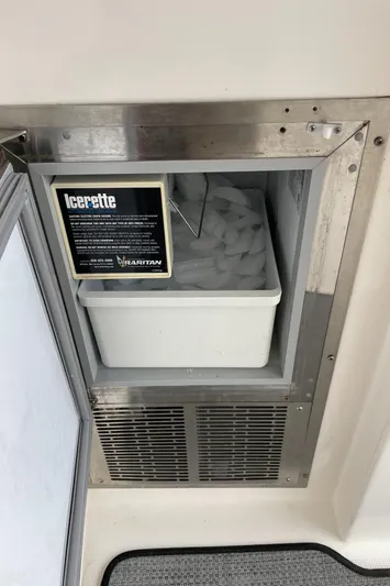  Yacht Photos Pics Ice maker on a 2002 Pursuit 3800 Express boat, featuring a stainless steel finish.