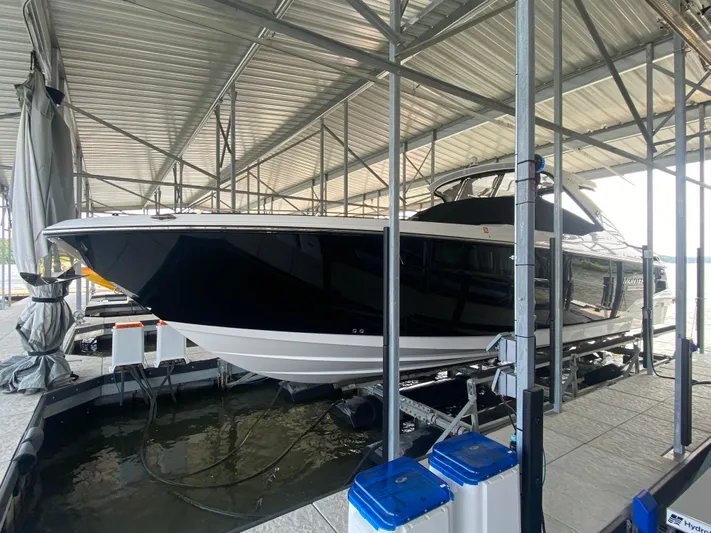  Yacht Photos Pics 2022 Monterey 385 Super Sport boat docked in a covered marina.