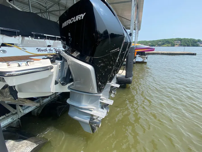  Yacht Photos Pics 2022 Monterey 385 Super Sport with Mercury outboard engine docked on a sunny day.