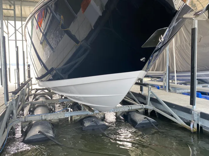  Yacht Photos Pics 2022 Monterey 385 Super Sport boat on lift in marina.