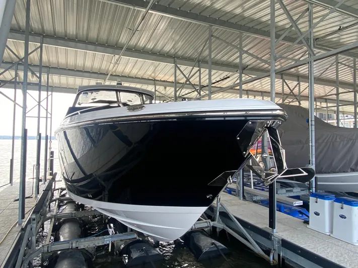  Yacht Photos Pics 2022 Monterey 385 Super Sport boat docked in a covered marina.