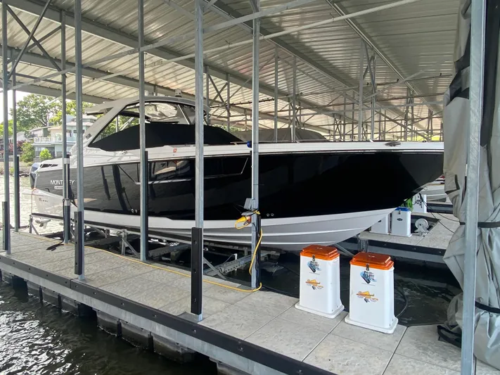  Yacht Photos Pics 2022 Monterey 385 Super Sport boat docked in a covered marina.