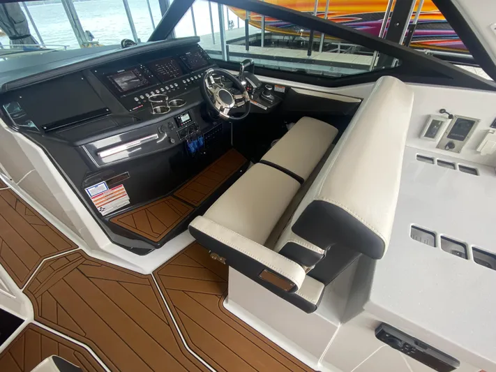  Yacht Photos Pics 2022 Monterey 385 Super Sport cockpit with modern controls and sleek seating.
