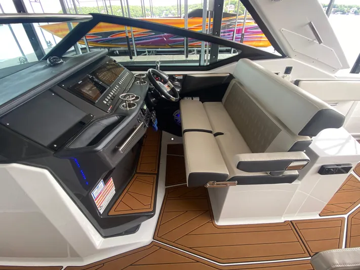  Yacht Photos Pics 2022 Monterey 385 Super Sport boat interior with modern helm and seating.