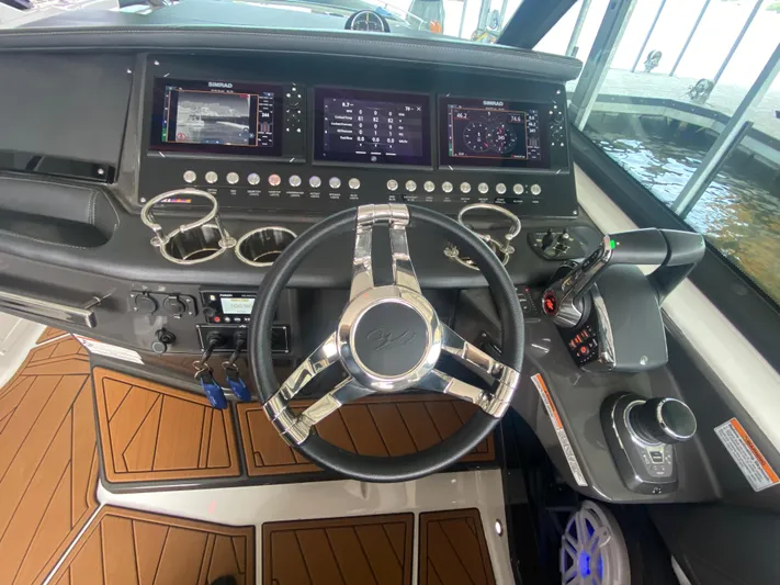  Yacht Photos Pics 2022 Monterey 385 Super Sport boat dashboard with modern controls and steering wheel.