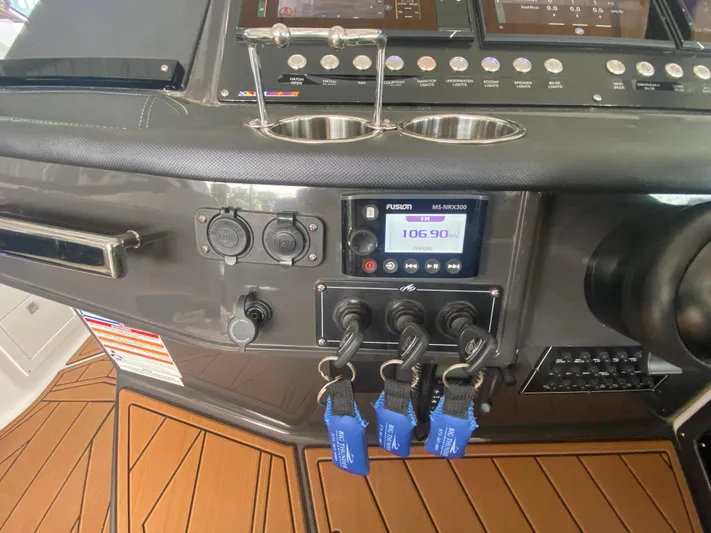  Yacht Photos Pics Control panel of 2022 Monterey 385 Super Sport boat with modern navigation equipment.