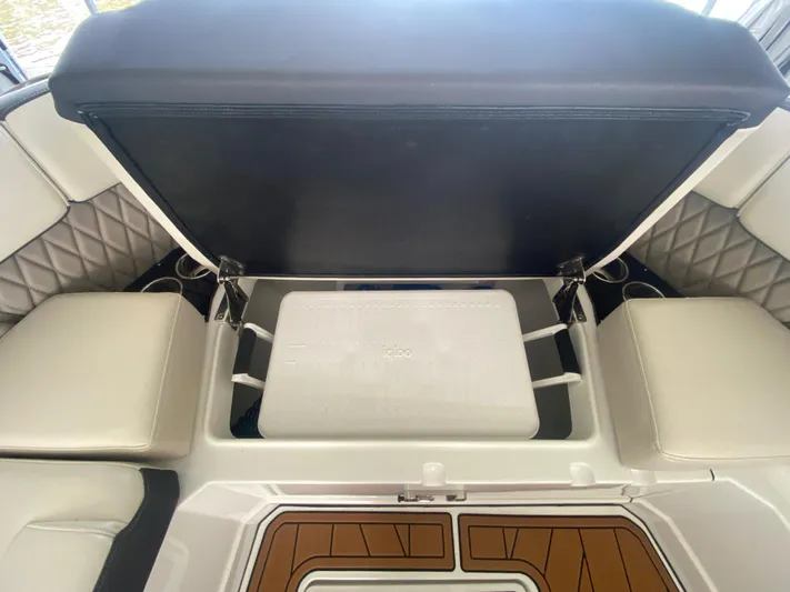  Yacht Photos Pics 2022 Monterey 385 Super Sport boat interior with open storage compartment and seating.