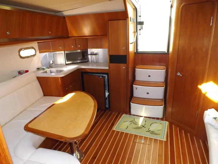  Yacht Photos Pics Interior of 2007 Tiara Yachts 3600 Sovran with wood finish and compact kitchen.