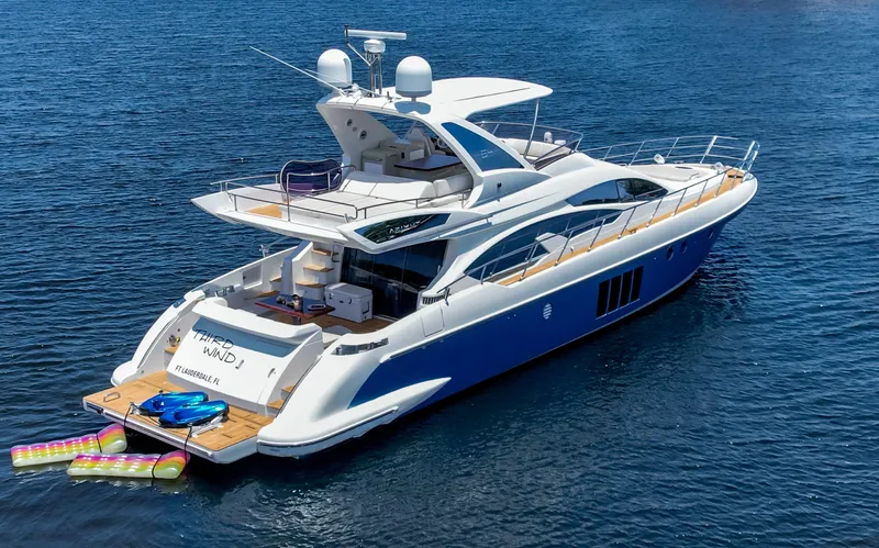  Yacht Photos Pics Luxurious 2013 Azimut 64 yacht on open water, featuring sleek design and spacious deck.