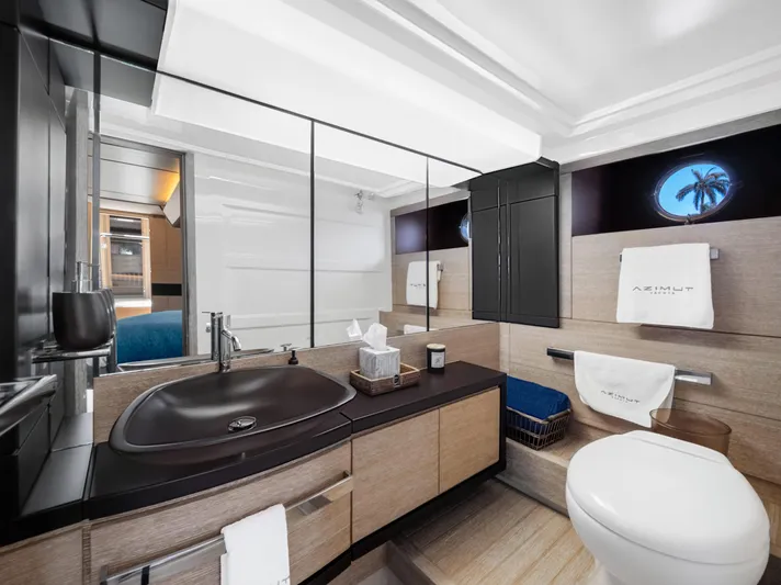  Yacht Photos Pics Luxurious bathroom in 2013 Azimut 64 yacht with modern fixtures and elegant design.