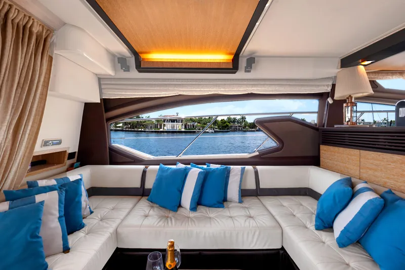 Yacht Photos Pics Luxurious interior of 2013 Azimut 64 yacht with plush seating and scenic water view.