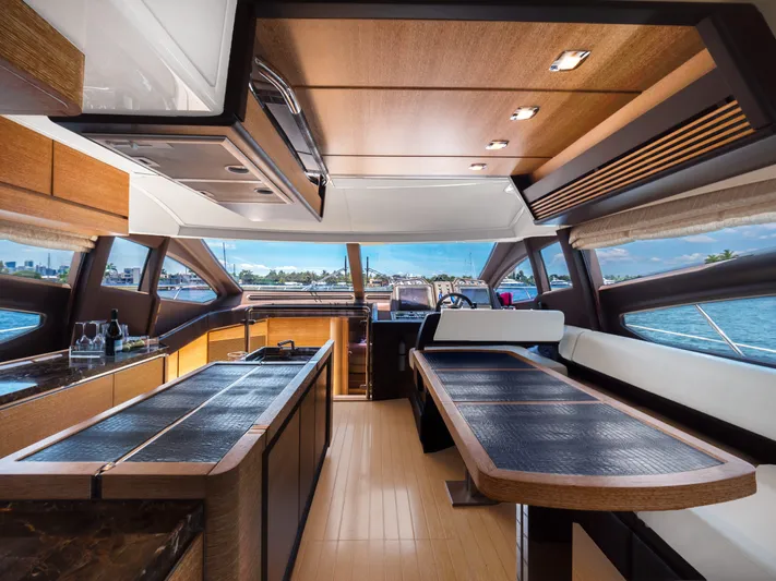  Yacht Photos Pics Luxurious interior of 2013 Azimut 64 yacht with modern kitchen and dining area.